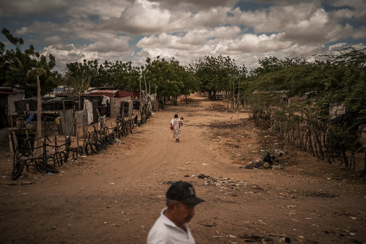 La Pista, el mayor asentamiento de migrantes de América sufre por los recortes de Trump: “Nos sentimos impotentes”